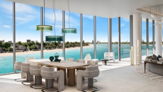 Palm Central dining room with full-height glazing on the beach