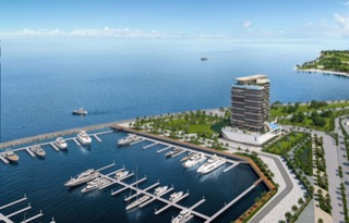 Aerial view of LIV Oceanside tower directly on the Dubai Islands Marina